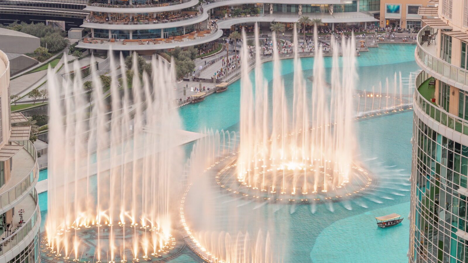 Dubai singing fountains with walking area around aerial view timelapse.