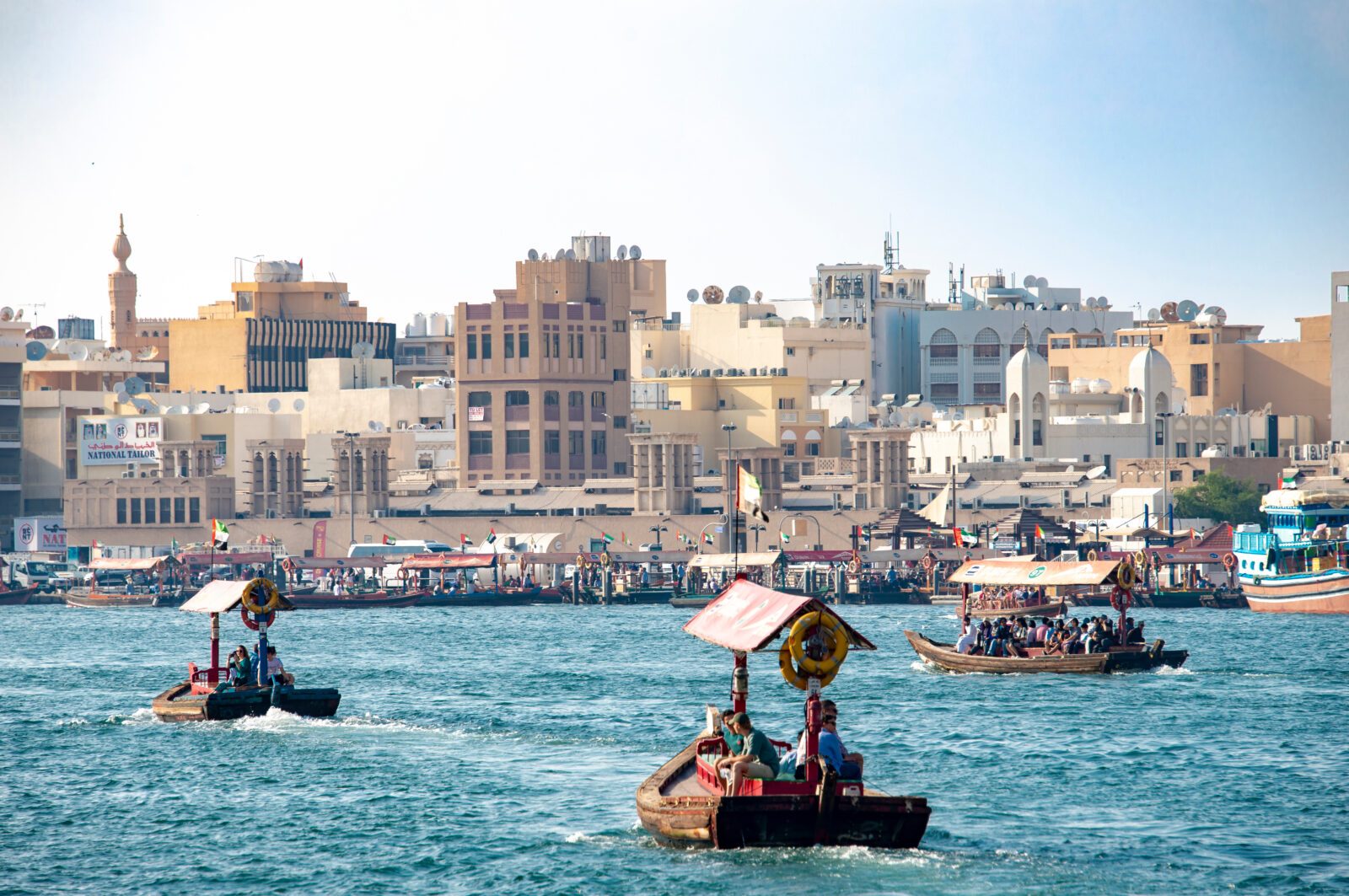 Old Dubai view over the creek towards Deira side with traditional water taxi (abra).