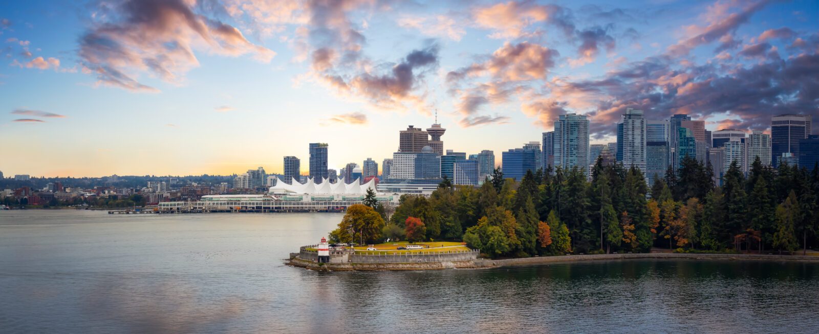 Vancouver, British Columbia, Canada. Beautiful Panoramic View of Modern Downtown City, Stanley Park and Coal Harbour. Colorful Sunrise Sky Composite. Cityscape Panorama